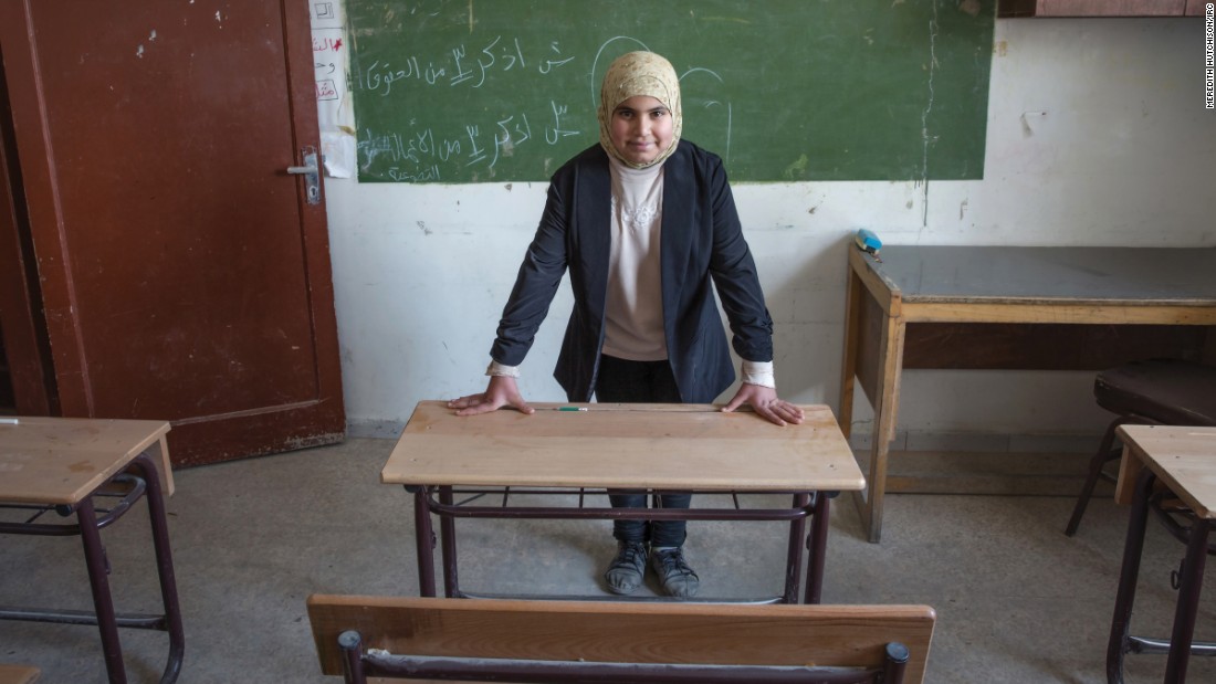&quot;In this image, it is the early morning, and I am waiting in my classroom for my students to arrive. I teach younger children to read and write Arabic. I am strict, but I go out of my way to gently help those students who are having difficulties.&quot;