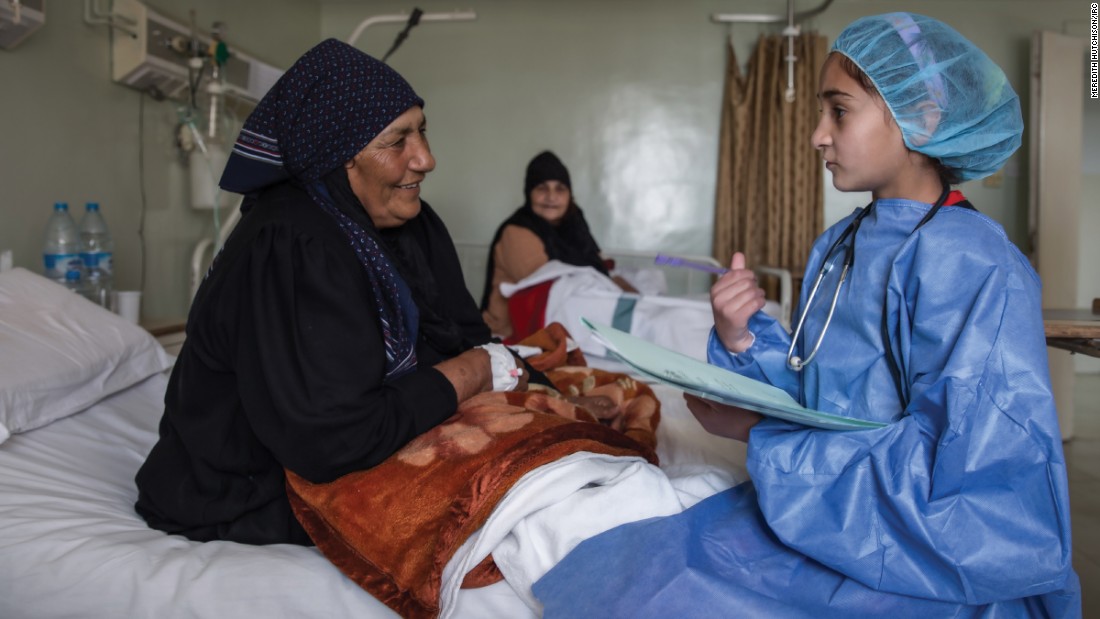 &quot;In this image, I am in the future and a well-respected physician at a major hospital in Syria. I am asking a patient about her pain and helping her to get better. My mother was born and raised in a village and didn&#39;t go to school, but as a young girl, I had the opportunity to learn and grow into a great doctor.&quot;