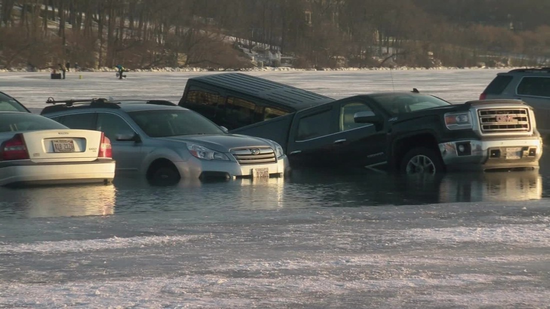 Cars fall into lake during winter festival - CNN Video
