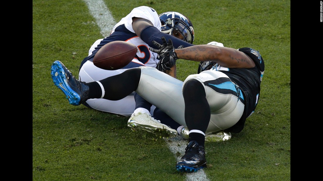 Tolbert fumbles in the first half as he is hit by the Broncos&#39; Darian Stewart, left.