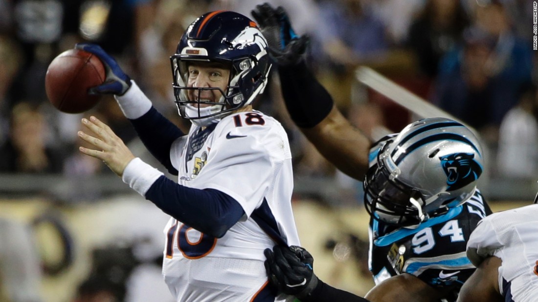 Broncos quarterback Peyton Manning is hit by Carolina&#39;s Kony Ealy in the fourth quarter. The hit forced a fumble, and Carolina recovered the ball.