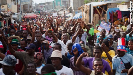 Demonstrators chant anti-government slogans in the capital of Port-au-Prince. 