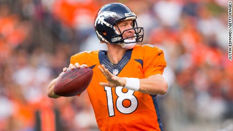 Peyton Manning says goodbye to football