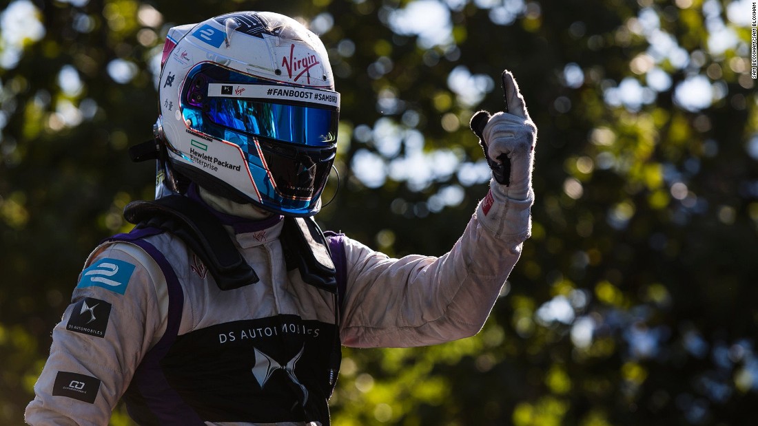 A joyous Sam Bird gives a one-fingered victory salute after the Formula E ePrix in Buenos Aires. 