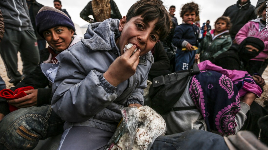 Syrian refugees are pictured in a camp as they flee the city of Aleppo on February 6.