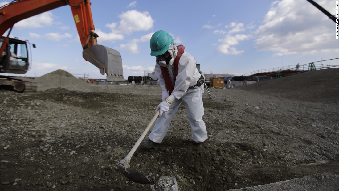 A worker levels out the ground at the Fukushima Daiichi nuclear plant on February 10.