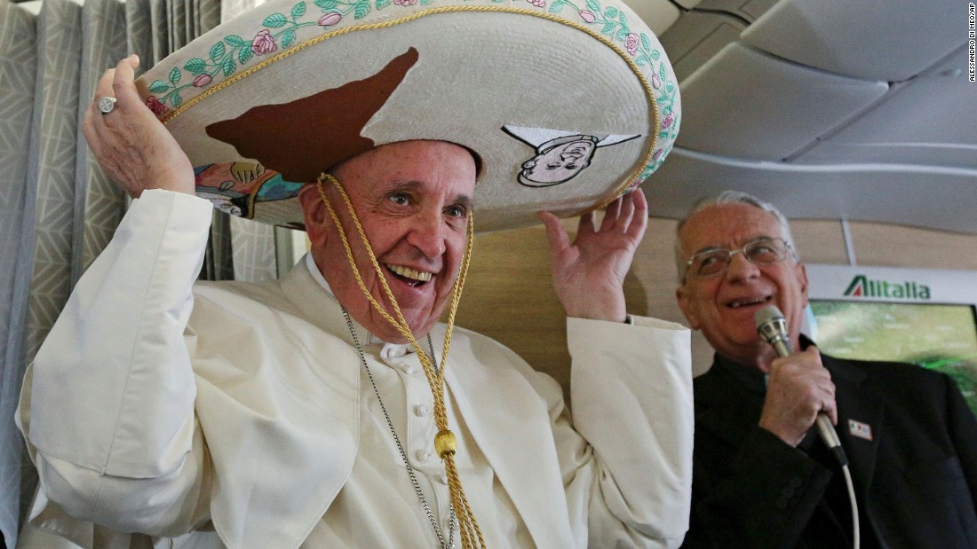 Pope Francis tries on a traditional sombrero he received as a gift from a Mexican journalist on Friday, February 12, 2016, aboard a flight from Rome to Havana, Cuba. The voyage kicked off his weeklong trip to Mexico. With his penchant for crowd-pleasing and spontaneous acts of compassion, Pope Francis has earned high praise from fellow Catholics and others since he succeeded Pope Benedict XVI in March 2013.