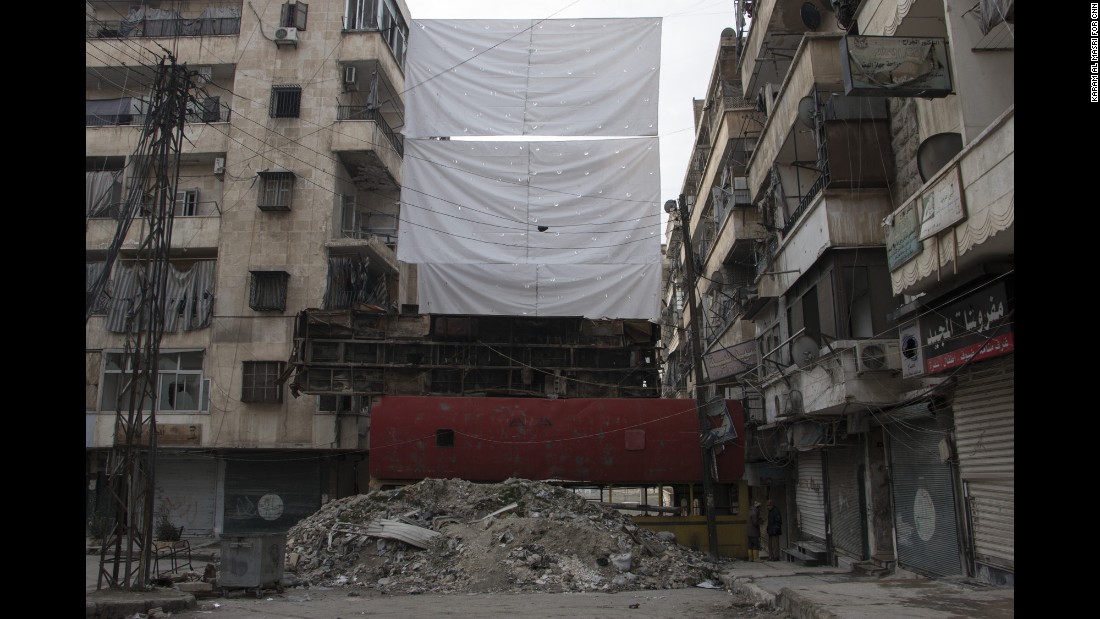 Buses piled one on top of the other offer some protection from enemy fire.