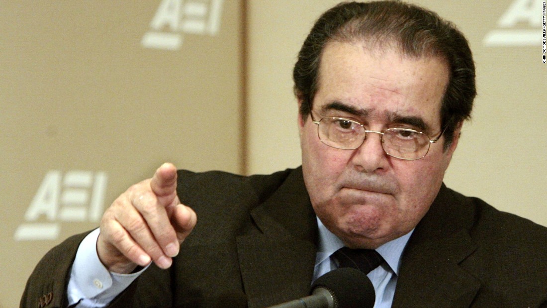 Scalia calls on people during a question-and-answer period at the American Enterprise Institute on February 21, 2006, in Washington. Scalia delivered the keynote address about foreign law and the debate about how it is used in American Law during the seminar called &quot;Outsourcing Of American Law.&quot;
