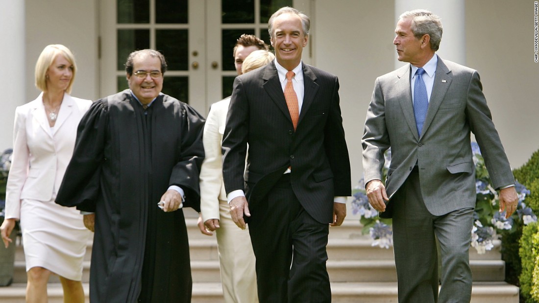 Heather Myklegard, Scalia, Dirk Kempthorne and U.S. President George W. Bush walk through the Rose Garden before Kempthorne is sworn in as the new interior secretary at White House on June 7, 2006, in Washington.