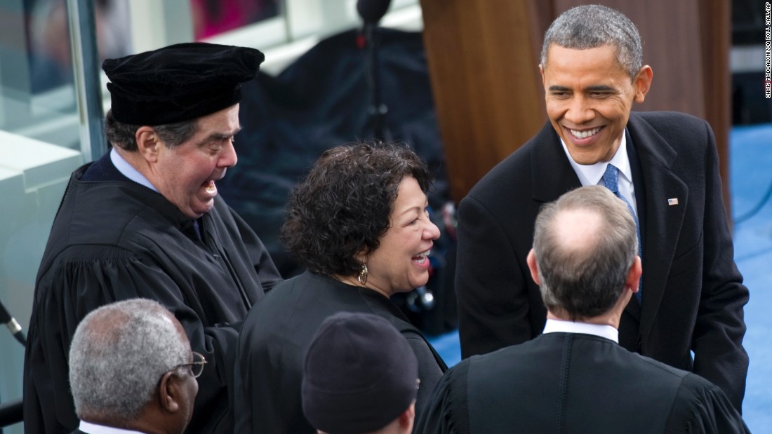 U.S. President Barack Obama greets Supreme Court Justices Clarence Thomas, Antonin Scalia, Sonia Sotomayor, Anthony Kennedy and John Roberts at Obama&#39;s inauguration for his second term of office. 