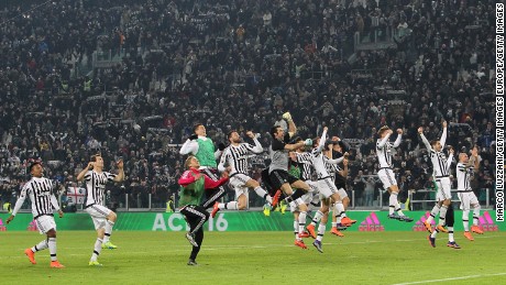 Juventus players celebrate its narrow 1-0 win over Napoli on February 13.