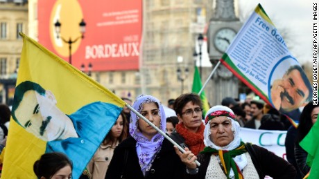 People wave flags with the portrait of the jailed leader of the Kurdistan Workers Party (PKK) Abdullah Ocalan during a demonstration in Bordeaux on January 23, 2016 called by associations for the defence of the Kurdish people and the &#39;Mouvement de la Paix&#39; to denounce Turkish operations in southeast Turkey. / AFP / GEORGES GOBETGEORGES GOBET/AFP/Getty Images