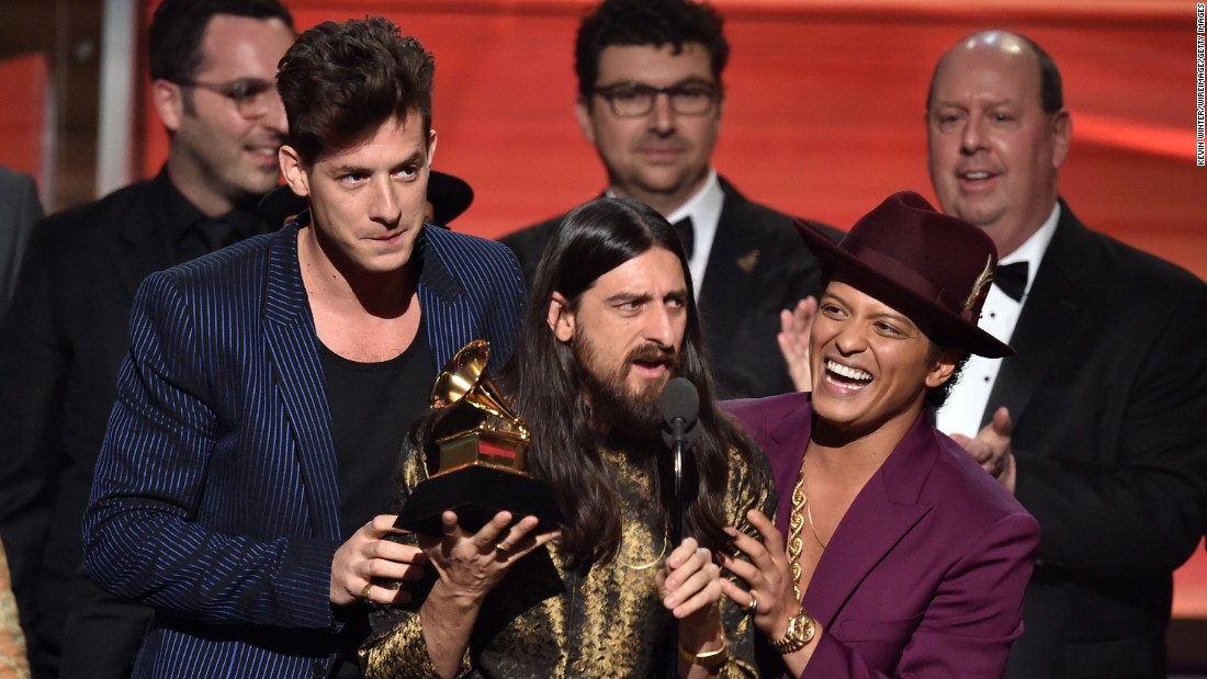 &quot;Uptown Funk,&quot; Mark Ronson featuring Bruno Mars. Holding the Grammy between the two is producer Jeff Bhasker. The song also won the Grammy for best pop duo/group performance.