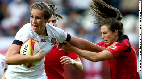 PARIS, FRANCE - AUGUST 17:  Emily Scarratt of England breaks free from a tackle by Brittany Waters of Canada during the IRB Women&#39;s Rugby World Cup 2014 Final between England and Canada at Stade Jean-Bouin on August 17, 2014 in Paris, France.  (Photo by Jordan Mansfield/Getty Images)