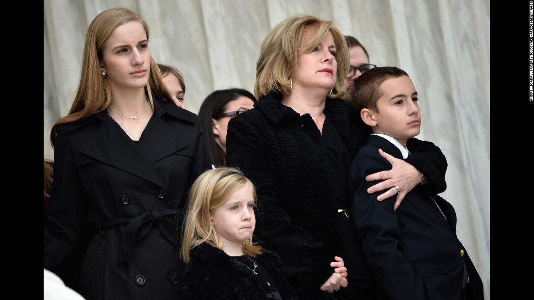 Family members watch as Scalia&#39;s casket is carried up the steps of the Supreme Court building on February 19.