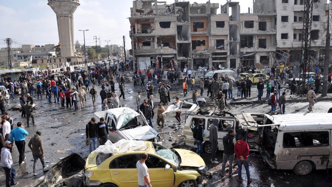 Syrians gather at the site of a double car bomb attack in the Al-Zahraa neighborhood of the Homs, Syria, on February 21, 2016. &lt;a href=&quot;http://www.cnn.com/2016/02/21/middleeast/syria-civil-war/index.html&quot; target=&quot;_blank&quot;&gt;Multiple attacks in Homs and southern Damascus&lt;/a&gt; kill at least 122 and injure scores, according to the state-run SANA news agency. ISIS claimed responsibility.