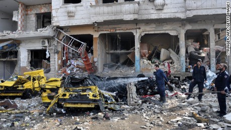 Syria: Dozens killed as bombers strike Homs, Damascus