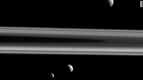 NASA has released a stunning image showing three of Saturn's moons and the planet's iconic rings. Tethys, Enceladus and Mimas were captured in the same shot by the Cassini spacecraft, which has studied the planet and its natural satellites since 2004. 
