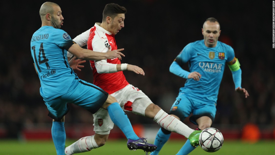 Arsenal, second in the English Premier League, started well with Mesut Ozil finding space against the Catalan club.