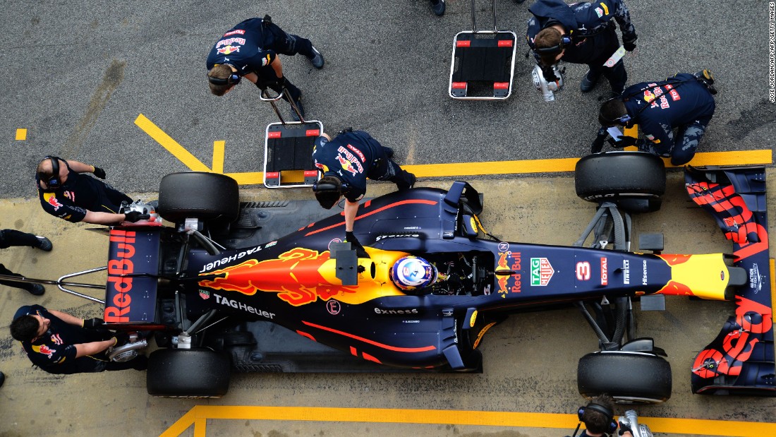 Looking good from above. The Red Bull Racing pit crew get set as Ricciardo brings his new racer back into the pits at the Circuit de Catalunya, the home of F1&#39;s winter testing.