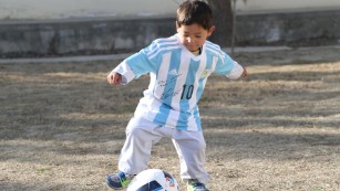 Afghan child gets a Lionel Messi jersey: How sports build bridges