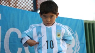 Afghan child gets a Lionel Messi jersey: How sports build bridges 