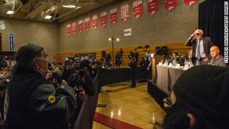  American Indian Movement co-founder, Clyde Bellecourt, left, presses Democratic presidential candidate Sen. Bernie Sanders on Native American issues at a forum on race and economic opportunity on February 12 in Minneapolis, Minnesota.