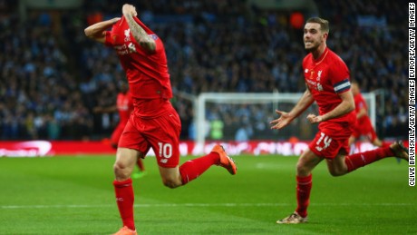 Philippe Coutinho celebrates with Jordan Henderson in pursuit after equalizing for Liverpool against Manchester City at Wembley.