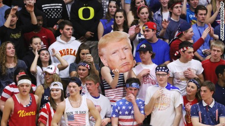Fans of Andrean High School held up a picture of GOP presidential candidate Donald Trump and shouted chants like &quot;Build a Wall&quot; during a basketball game against Bishop Noll Institute on Friday in Merrillville, Indiana. 