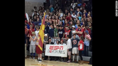 Fans of Andrean High School held up a sign that reads &quot;ESPN deportes&quot; and a poster of Donald Trump at a game in Merrillville, Indiana on Friday.