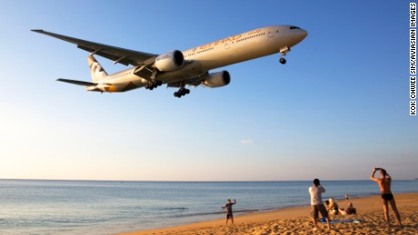 &quot;Each year, I take several trips to enjoy a spot of aviation photographing,&quot; says plane-spotter Kok Chwee Sim. &quot;This picture was taken end-December 2015 at Phuket International Airport. When the planes land from the west, they swoop low over the beach and this is a thrill for beachcombers and aviation spotters. The plane depicted here is a B777-300ER of Etihad Airways.&quot;