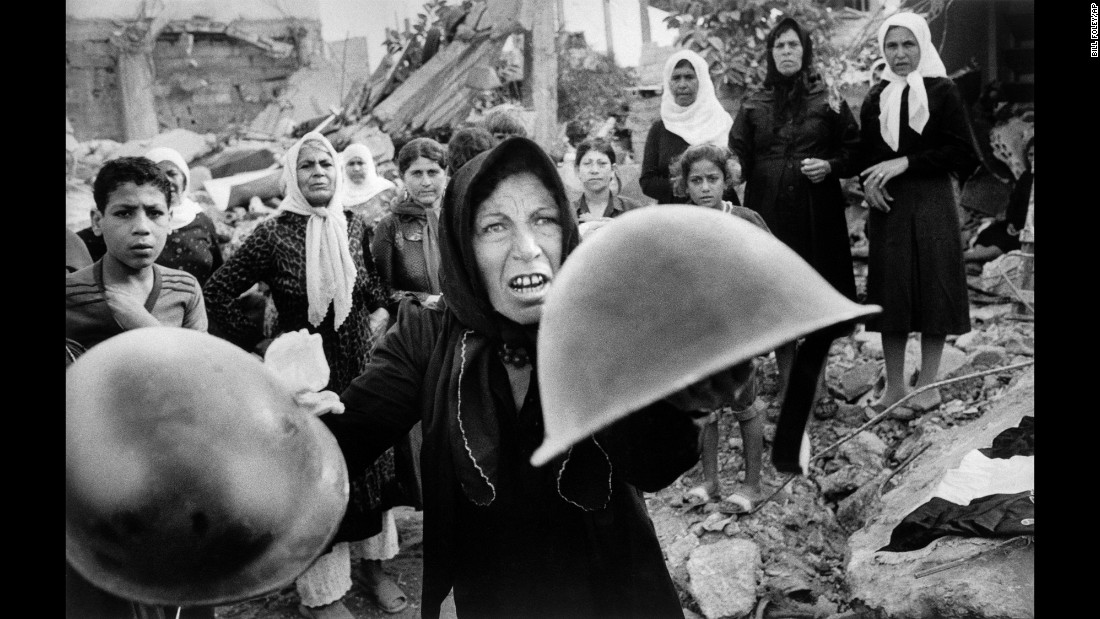 &lt;strong&gt;Sabra and Shatila massacre: &lt;/strong&gt;In this Pulitzer Prize-winning photo taken September 27, 1982, by Associated Press photographer Bill Foley, a woman holds up helmets that she believes were worn by those who killed hundreds of Palestinians at the Sabra and Shatila refugee camps during the 1982 Israel-Lebanon war. The murders were committed by Lebanese militia members, but an Israeli government inquiry determined Israel was complicit in the massacre.