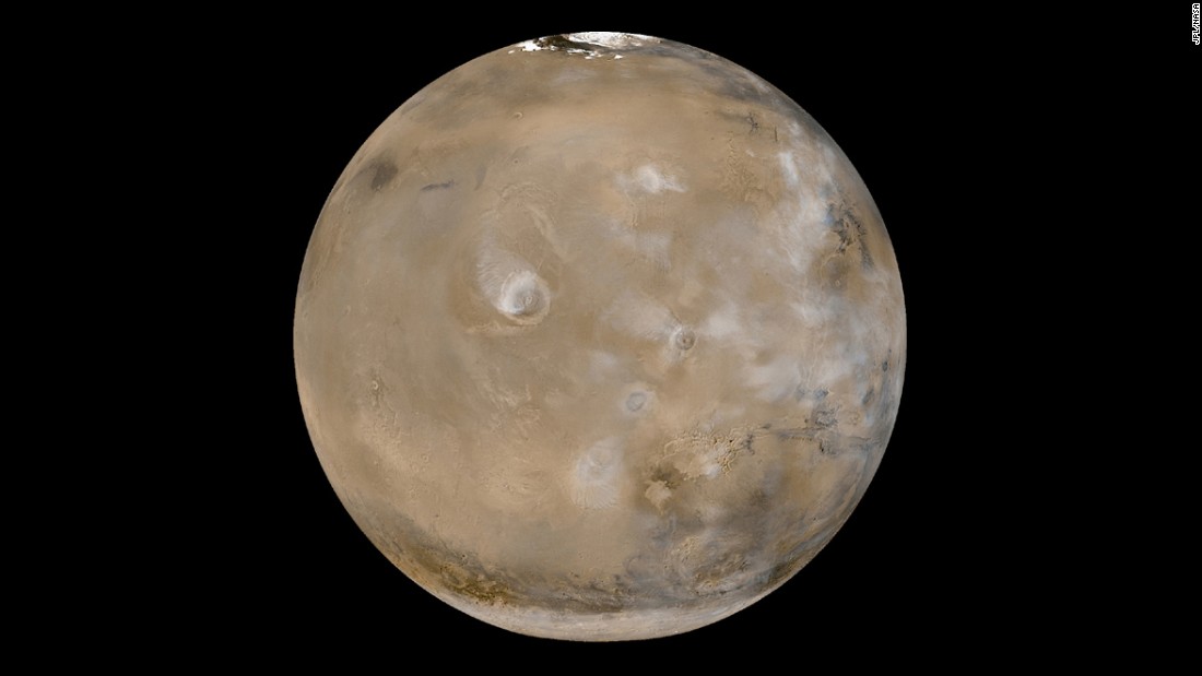 This view of Mars shows huge volcanoes in what&#39;s called the Tharsis Montes region. The photo is a composite of 24 images taken on February 14, 2003, by the Mars Global Surveyor, a NASA spacecraft orbiting the red planet. NASA says Tharsis Montes is the largest volcanic region on Mars. It&#39;s about 2,485 miles (4,000 kilometers) across and 6 miles (10 kilometers) high. It contains 12 large volcanoes, including Olympus Mons, the largest of the Tharsis volcanoes.