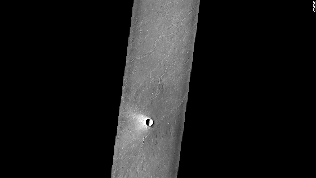 The area around the Olympus Mons volcano has lava flows, which appear as the lighter area near the volcano.