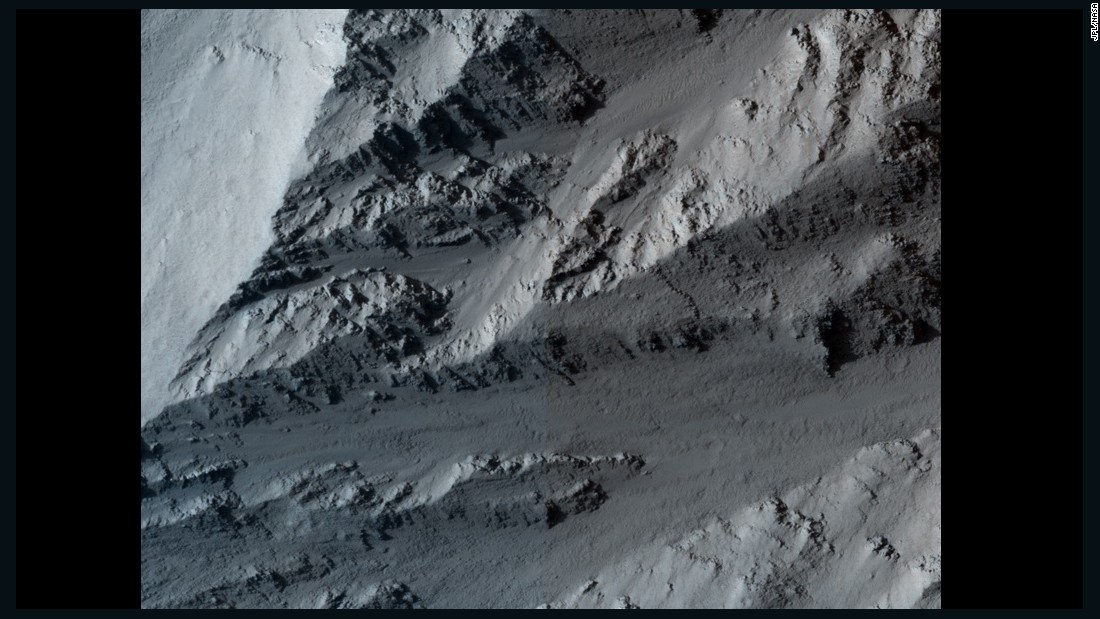 This image shows the northern edge of Olympus Mons on Mars. The cliff has hard layers of lava and soft layers that may be dust or volcanic ash. The image was taken by NASA&#39;s Mars Reconnaissance Orbiter on March 2, 2010.