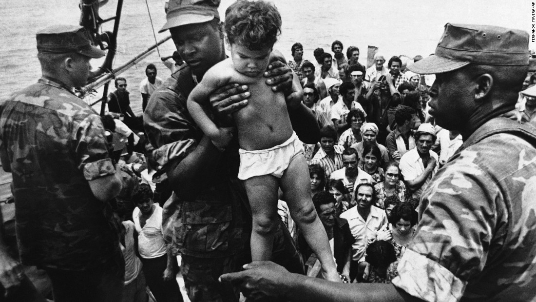 &lt;strong&gt;Mass exodus from Cuba:&lt;/strong&gt; Starting in April 1980, more than &lt;a href=&quot;http://www.politico.com/story/2009/04/castro-launches-mariel-boatlift-april-20-1980-021421&quot; target=&quot;_blank&quot;&gt;125,000 Cubans&lt;/a&gt; fled from the port of Mariel to Florida. Associated Press photographer Fernando Yovera captured this image of a U.S. Marine lifting a Cuban child off one of the boats that came into Key West on May 10, 1980. Of the 1,700 boats that made the journey from Cuba that year, many were overcrowded, and 27 migrants died before reaching the United States.