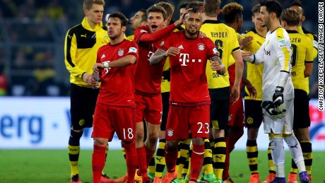 Juan Bernat, Thomas Mueller and Arturo Vidal of Bayern congratutalte each other after the Bundesliga match between Borussia Dortmund and FC Bayern Munich.