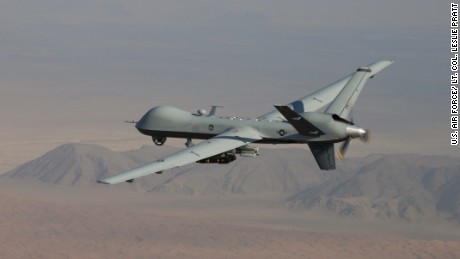 An MQ-9 Reaper, armed with GBU-12 Paveway II laser guided munitions and AGM-114 Hellfire missiles, piloted by Col. Lex Turner flies a combat mission over southern Afghanistan. (U.S. Air Force Photo / Lt. Col. Leslie Pratt)