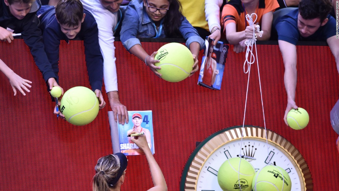 Sharapova signs autographs after winning a match at last  year&#39;s Australian Open. She later announced she had tested positive for banned drug meldonium and was banned for two years, later reduced to 15 months. 