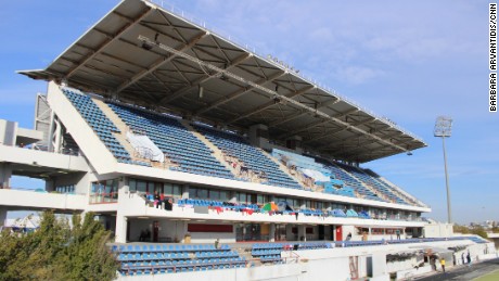 The hockey stadium at Athens&#39; old Olympic park is being used to house refugees.
