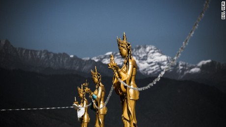 Perched above the capital, gold painted Dakinis - the angels of the Buddhist world - look over the valley below.