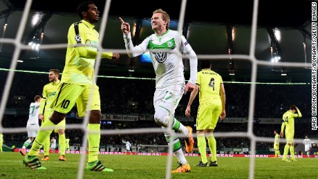 Andre Schurrle celebrates after scoring Wolfsburg&#39;s winner at home to Gent.