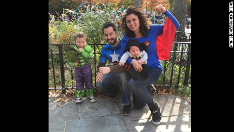 Raquel and Erwan Jegouzo pose as superheroes with their children.