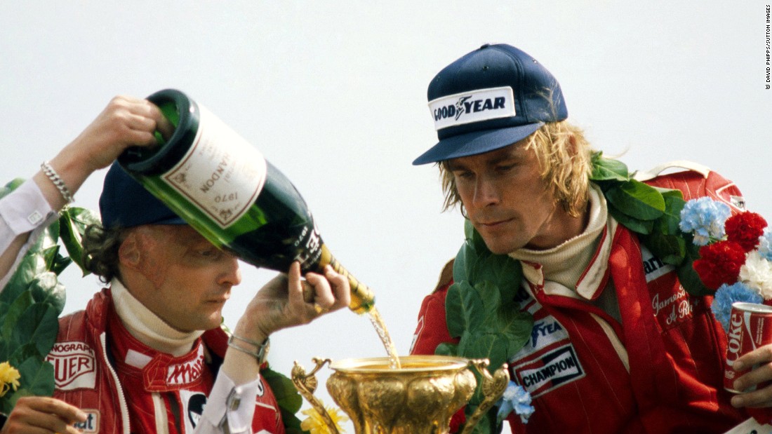 Lauda watches as champagne is poured into Hunt&#39;s trophy at the 1977 British Grand Prix at Silverstone. 