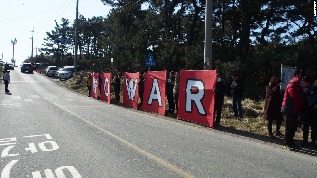 Protesters call for a more peaceful atmosphere on the Korean peninsula as South Korea and U.S. troops hold joint military exercises on March 12. 