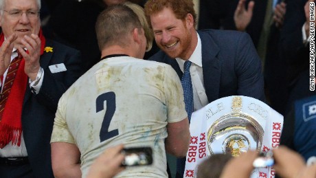 England captain Dylan Hartley received the trophy from Prince Harry.