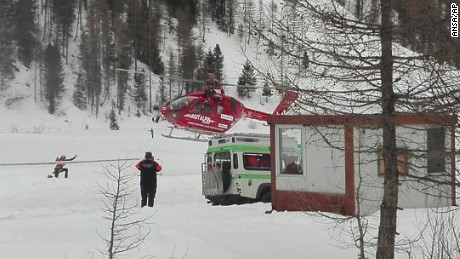 A rescue helicopter takes off in Valle Aurina in the Italian Alps to try to reach Monto Nevoso where at least six skiers have died in an avalanche Saturday, March 12, 2016. 