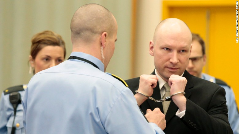 Norwegian mass killer Anders Behring Breivik has his handcuffs removed in court prior to giving testimony.