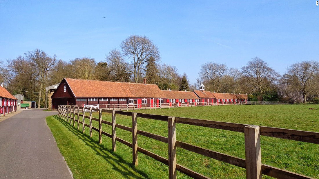 The beautiful grass paddocks and historic stable of Cheveley Park Stud, one of the oldest horse breeding centers in the world.